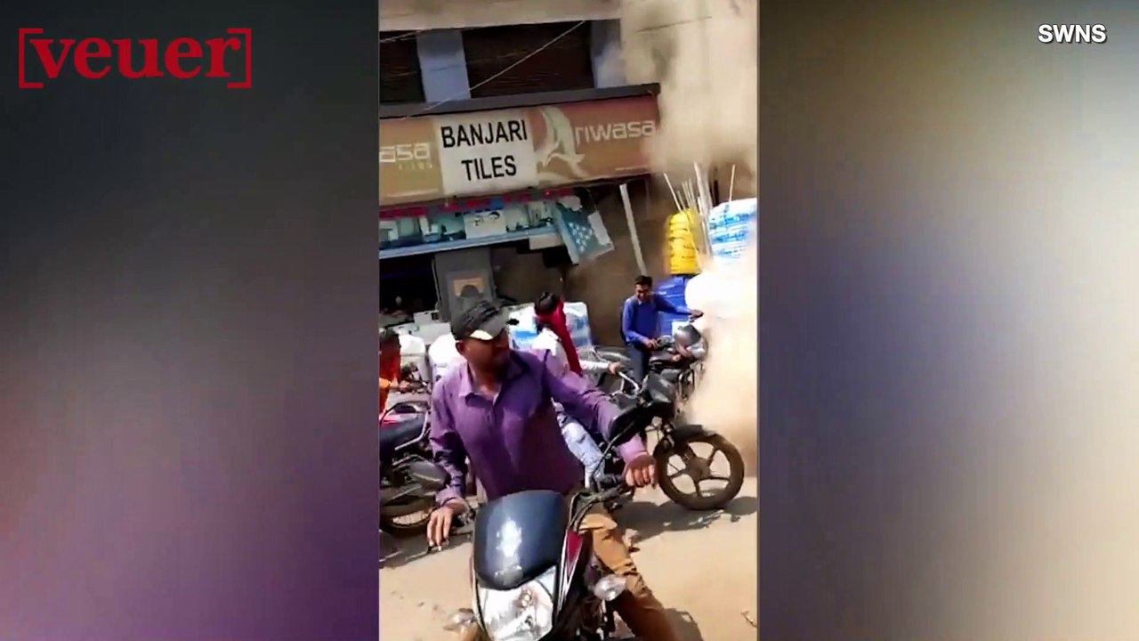 Shocking Footage Shows a Two-Story Building Collapsing, Nearly Crushing Pedestrians Below
