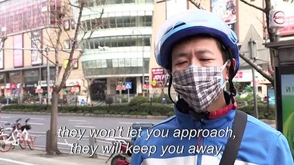 China's couriers take hands-off approach amid virus