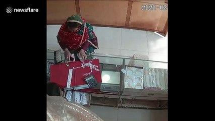 Bizarre moment herd of cows enters jewellery store in India