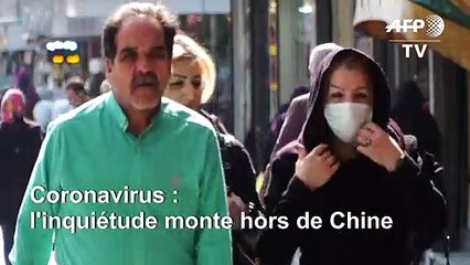 Coronavirus: des Iraniens portent des masques dans les rues de Téhéran