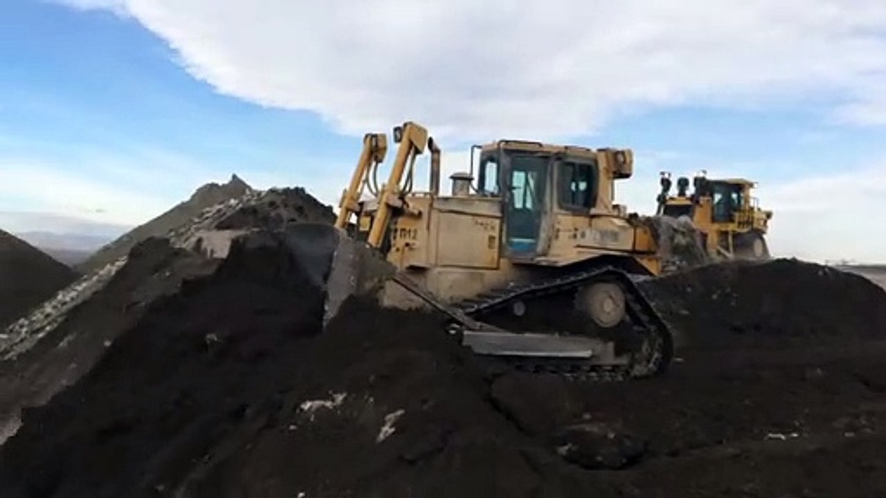 Caterpillar D9T Dozer And D7R Working Together