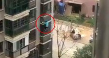 Çin'de virüs sebebiyle karantina altına alınan adam binanın kolonlarına tutunarak kaçtı