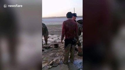 Police in northwest China rescue herdsman and his sheep trapped in wetland