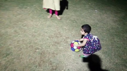 funny baby playing in park