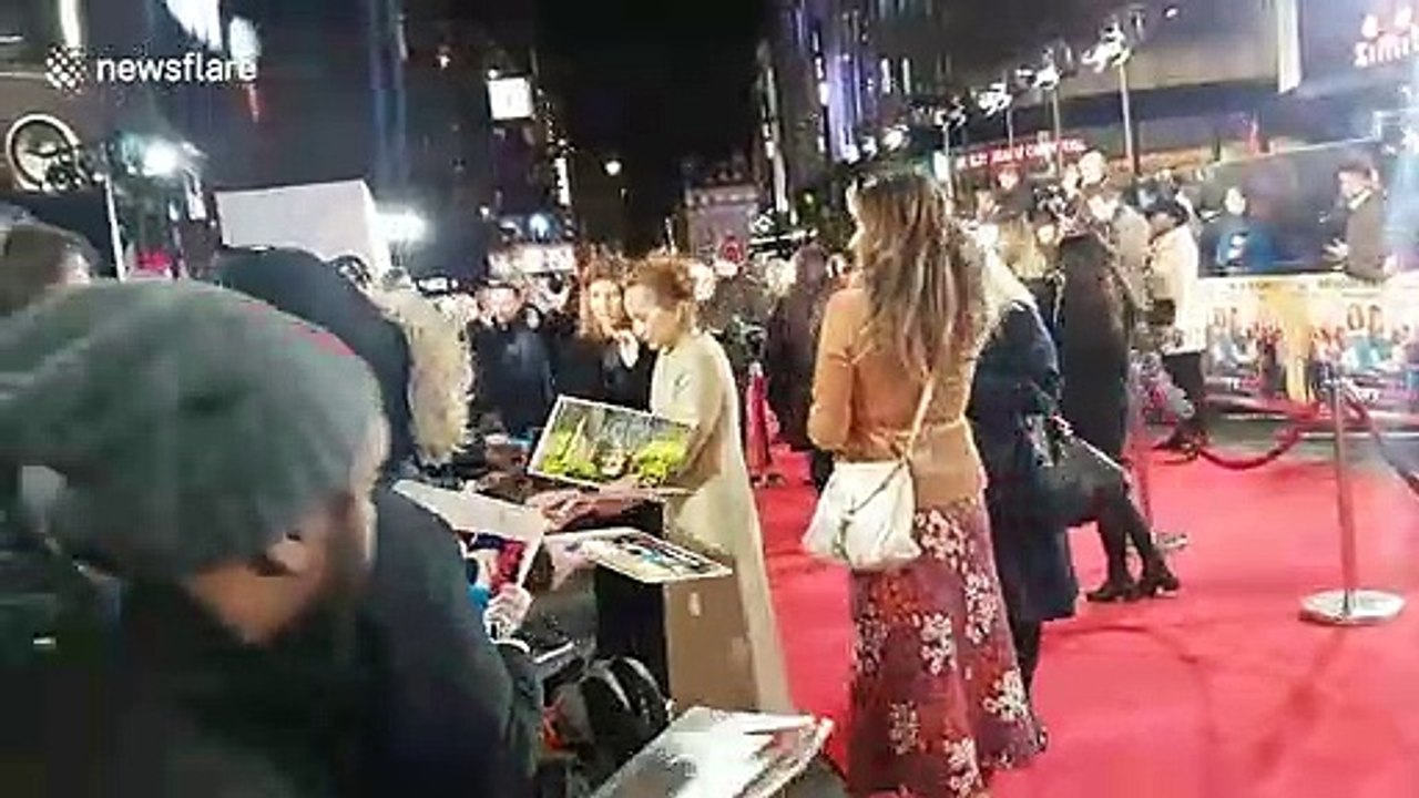 Kristin Scott Thomas and Sharon Horgan stop to sign autographs at 'Military Wives' film premiere