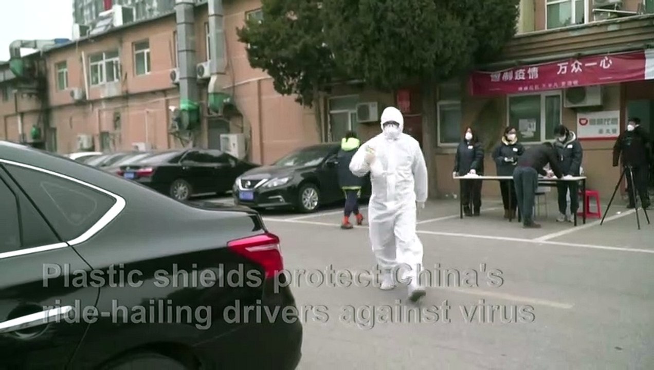 Plastic shields protect China's ride-hailing drivers against virus