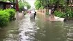 City overwhelmed as floodwaters race through streets, cut power