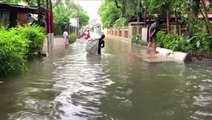 City overwhelmed as floodwaters race through streets, cut power