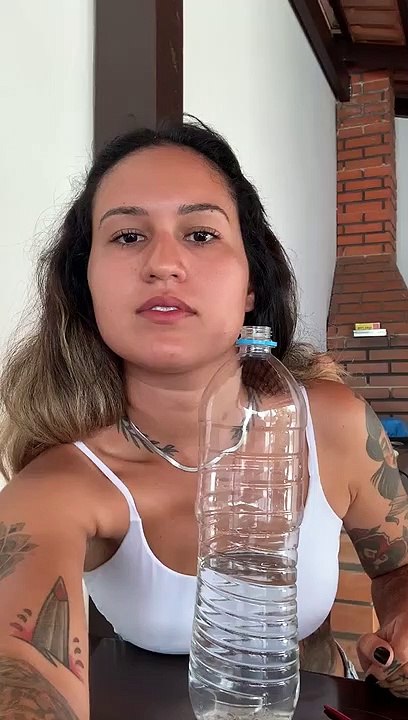 Woman Practices Magic Trick with an Apple and a...