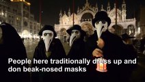 Venice carnival: Procession featuring 'plague doctor' masks