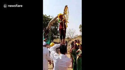 Woman tied to 60-foot-pole and hoisted like a flag in dangerous banned ritual in India