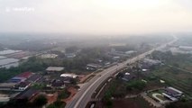 Aerial footage shows thick clouds of air pollution choking parts of Thailand