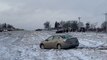 Cars slide off busy and snowy Missouri highway