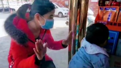 Coronavirus nurse kisses son through glass window after not seeing him for 26 days