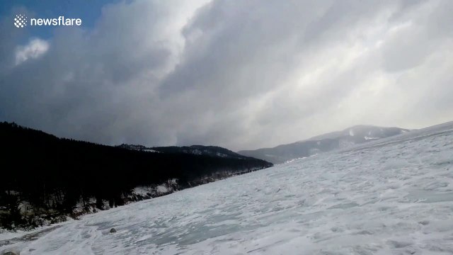 The sound of melting ice cracking on this Russian lake is very satisfying