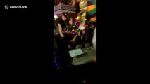 'Mardi Gras is wild!' Men dancing on moving car fall off during insane New Orleans party