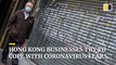How are businesses and institutions in Hong Kong coping with the coronavirus outbreak?