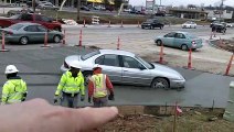 Sedan Gets Sunk in Wet Cement