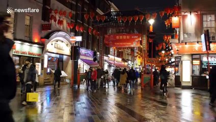 Anti-coronavirus face masks becoming common in London's Chinatown