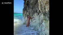 Bikini-clad model's perfect beach picture RUINED by monster wave