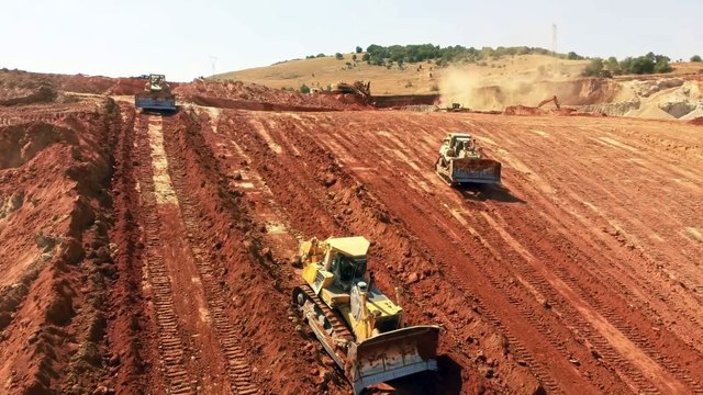 Two Cat D9R And Komatsu D275AX Bulldozers Pushing Soil