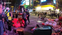 Hong Kong police fire tear gas as protesters return to streets despite coronavirus fears