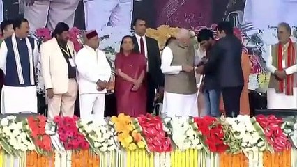 PM Modi taking selfi with differently able child