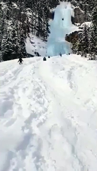 Woman Slides Down A Hill Of Snow