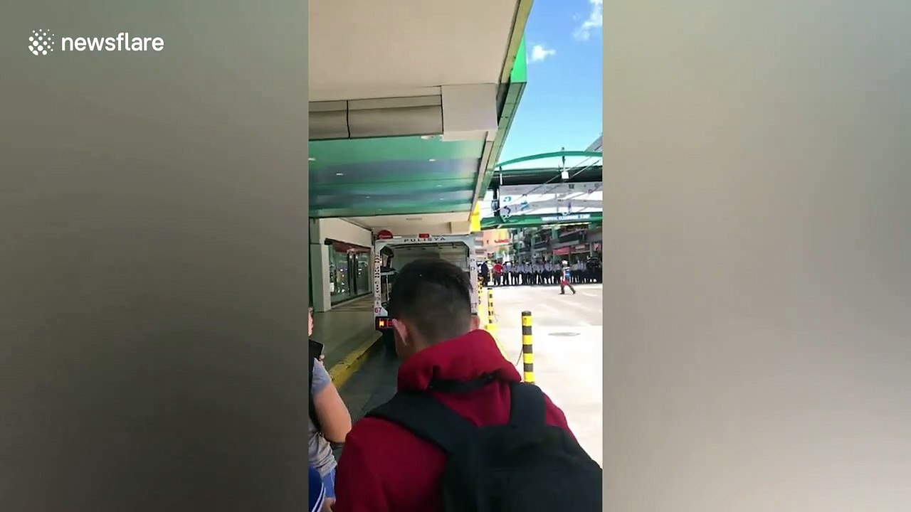 Armed police surround shopping mall after gunman shoots one and takes 30 hostages in Manila, Philippines