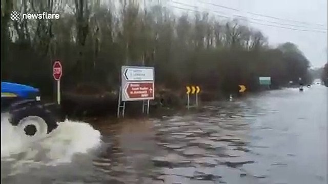 Tractors and jet skis share flooded roads in Ireland after Storm Jorge's rainfall