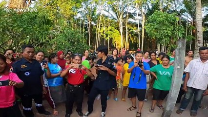 Thai rescue worker uses GoPro to show him catching king cobra in family's home