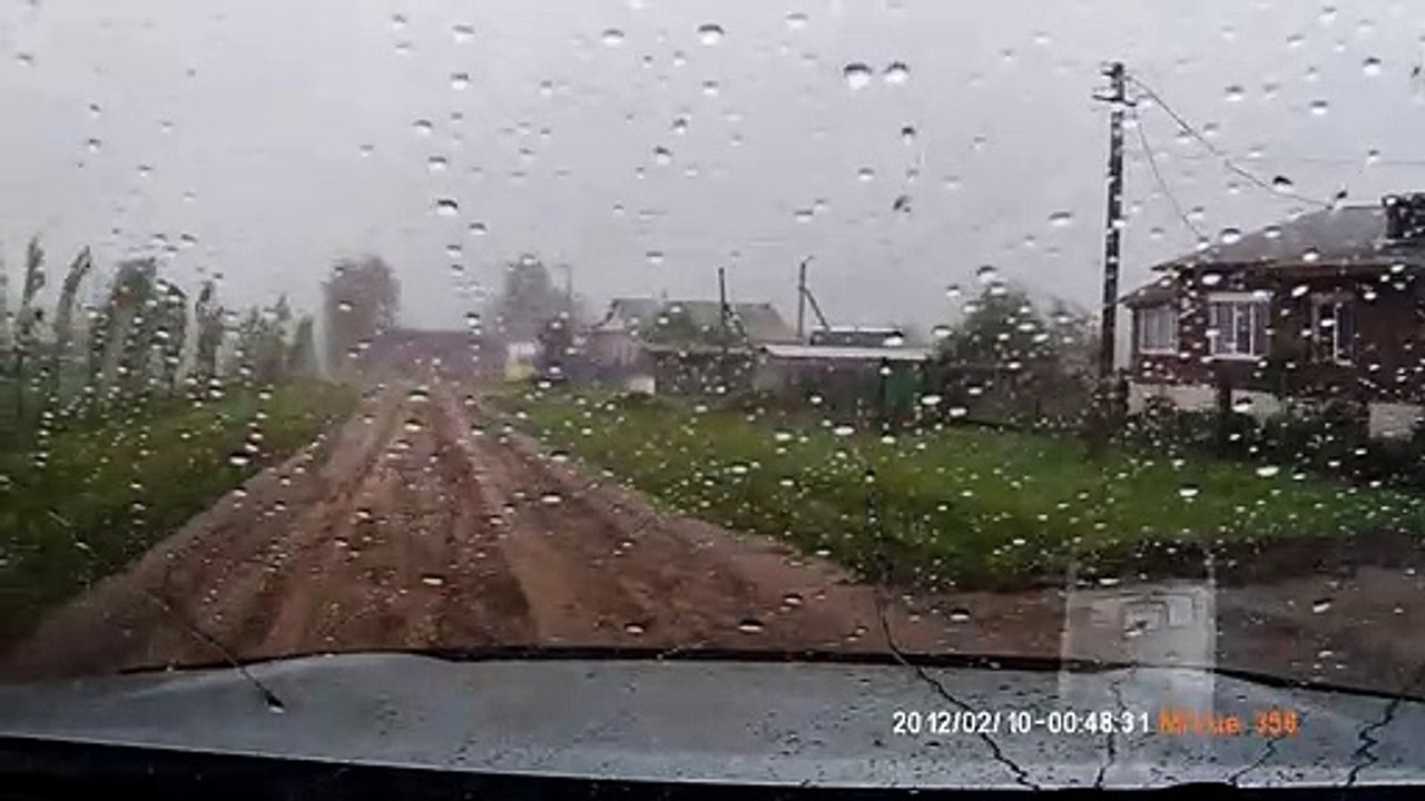 Man Pulls Out of His Garage Just as a Tornado Arrives