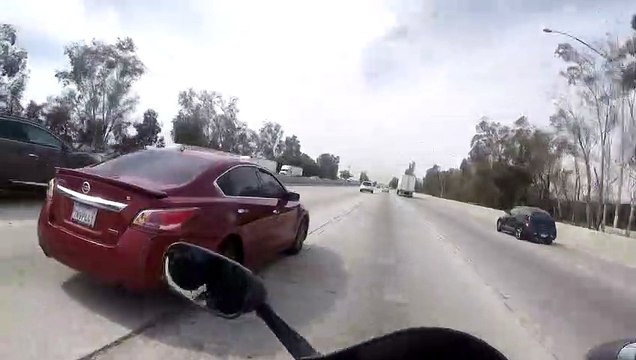 Merging Car Send Motorcycle Into Tiny Gap