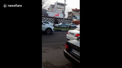 'Absolute sham': Masked, desperate Iranians line up for flu medicine amid coronavirus scare