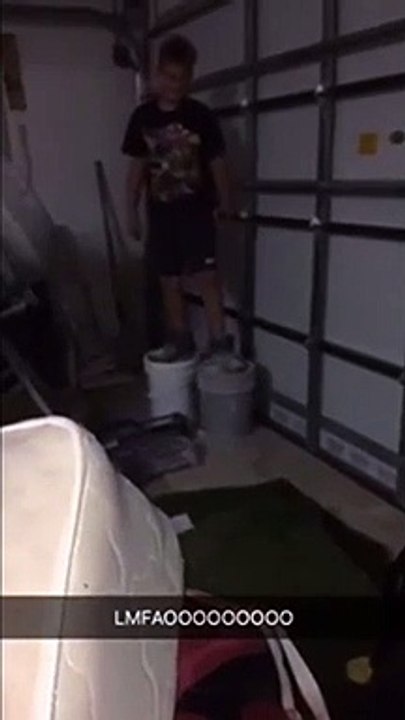 Boy Walking On A Large Bottle Of Compund