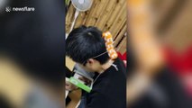 Chinese teacher creates phone holder by himself so he can live stream lessons to students due to coronavirus lockdown