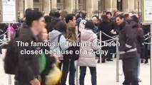 Happy tourists react to Louvre reopening after coronavirus fears