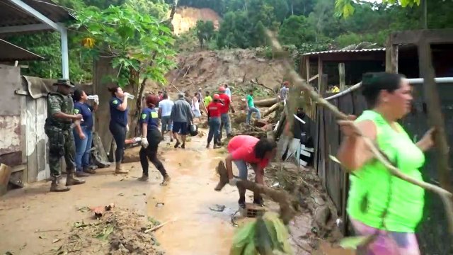 Rescuers search for survivors after a landslide leaves 19 dead in Brazil