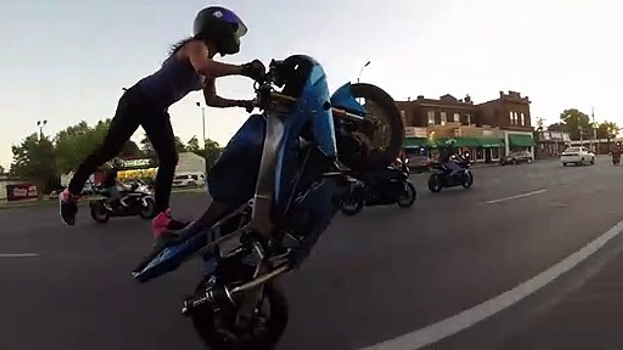 Crazy girl does motorcycle stunts