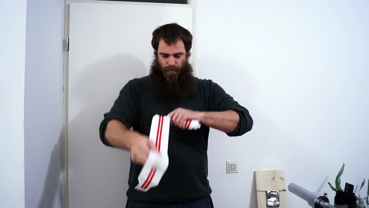 Old time strongman JK bending a 0,6x18cm nail with wraps and barehanded