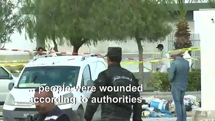 Body bag seen at the scene of an explosion near US embassy in Tunis
