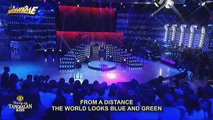 Rachel Gabreza sings her own version of ""From A Distance""