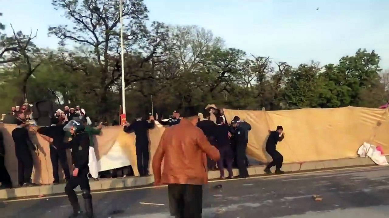 Lal Masjid and Jamia Hafsa members throwing stones at  Aurat Azadi March