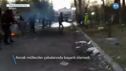 Mülteciler iple sınır kapısını yıkmaya çalıştı