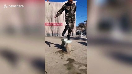 Chinese policeman shows off incredible balance by jumping on bowls of water
