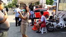 Health workers screen Thai students for coronavirus during school exams