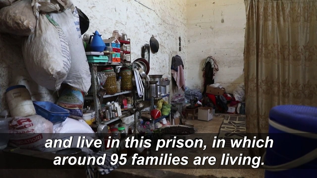 Displaced families seek shelter at abandoned prison in Idlib, Syria
