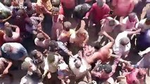 Indian festival-goers throw human ashes at each other in strange ritual