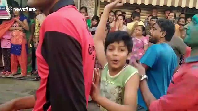 Sole-ful! Indian festival colors, Holi, involves hurling SHOES at one another