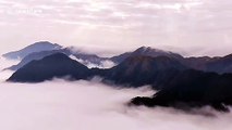 Sea of clouds flow over Chinese mountains in this spectacular drone footage